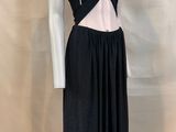 the mannequin is wearing a black dress with a white top and black skirt