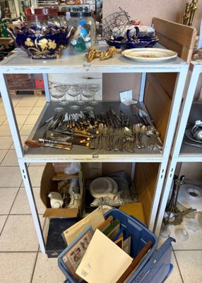 a cart with many items on it in a room