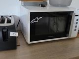 a microwave sitting on top of a counter next to a toaster oven