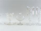 a lot of glass items that are sitting on a table