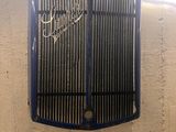 an image of a vintage car grille on a wall