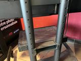 a metal table with a shelf on top of it