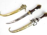 three different types of knifes on a white surface