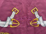 two pairs of scissors and a pair of scissors on a cloth