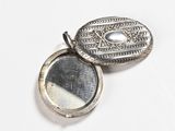 a silver locke with a mirror in it on a white surface