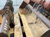 a close up of a fork on a pallet in a warehouse