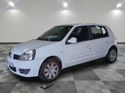 a picture of a white car parked in a garage