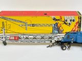 a toy truck with a crane on the back of it
