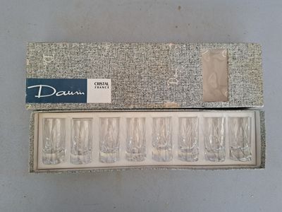 a box of empty wine glasses sitting on a table