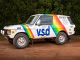a van that is parked on the side of a dirt road
