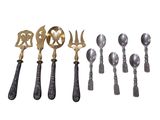 a group of silver and gold spoons and spoon spoons