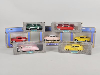 six different model cars in a display case