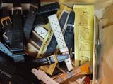 a box full of belts and other items on the table