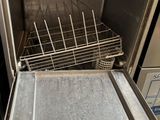 a silver oven with a metal tray inside of it