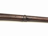 une image représentant un très vieux pistolet sur fond blanc