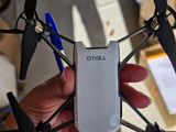 a person holding a remote control drone in their hand