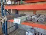 many rolls of metal on the shelves in the warehouse