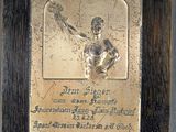 an image of a plaque of a man holding a tennis racquet