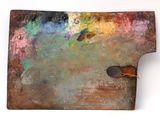 an image of a close up of a paint palette with a person standing next to it