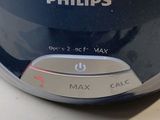a close up of a black and silver electronic device on a table