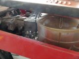 an image of a machine that is working on a piece of metal