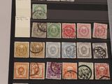 an image of a collection of stamps on display in a glass case