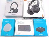 three boxes of headphones are sitting on a white surface