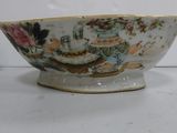 a bowl and two cups sitting on a table