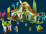 a small toy house with a horse and a donkey