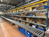 many boxes on the shelves in the warehouse