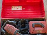an image of a red tool box with tools inside of it