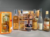 several bottles of liquor are lined up in a row on a table