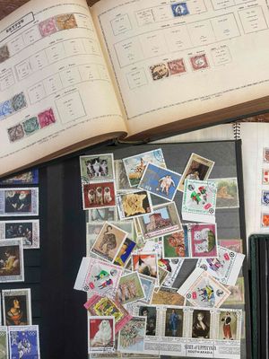 a book with stamps on it sitting on a table