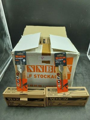 two boxes of knives are sitting on a table next to a box of knives