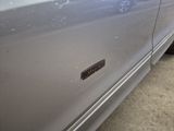 a close up of a car door with a sticker on it
