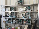 a room with a lot of electronics on the shelves