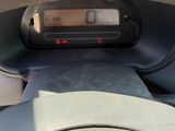a digital clock on the dashboard of a car