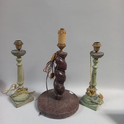 three candles that are sitting on a table
