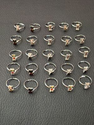 a lot of rings that are sitting on a table