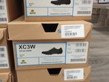 boxes of shoes are stacked on top of each other on the floor