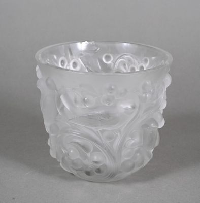 a glass cup with a design on it