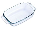 a clear glass baking dish with a handle on a white background