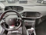 a steering wheel and dashboard of a car in a parking lot