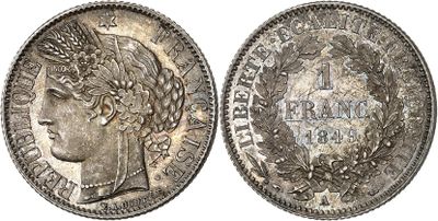 a silver coin with a woman ' s head on it