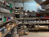 a room filled with lots of clutter and tools
