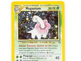 a close up of a pokemon card on a white surface