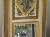 a mirror that has a picture of a woman on it
