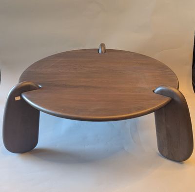 a wooden table with a metal handle on it