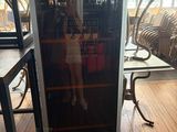a refrigerator that is sitting on the floor in a room