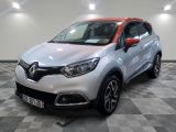 the front of a silver and red car on a checkered floor